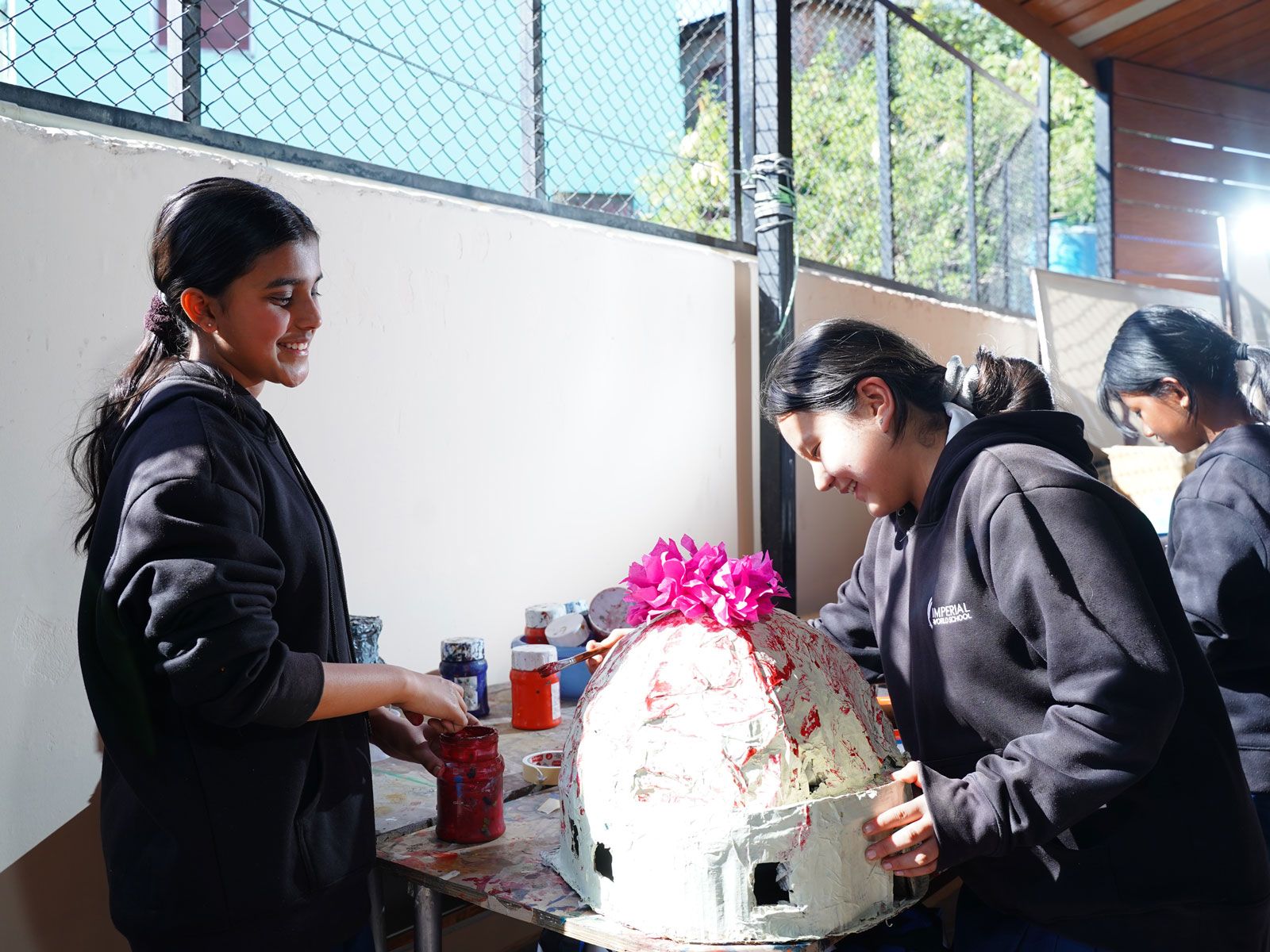 Students at Imperial World School participating in a school art event.