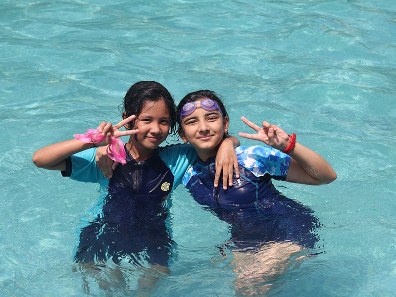 Students from Imperial World School, Kathmandu, swim in a pool. Making a Splash: Grades 1-10, 21 June 2024.