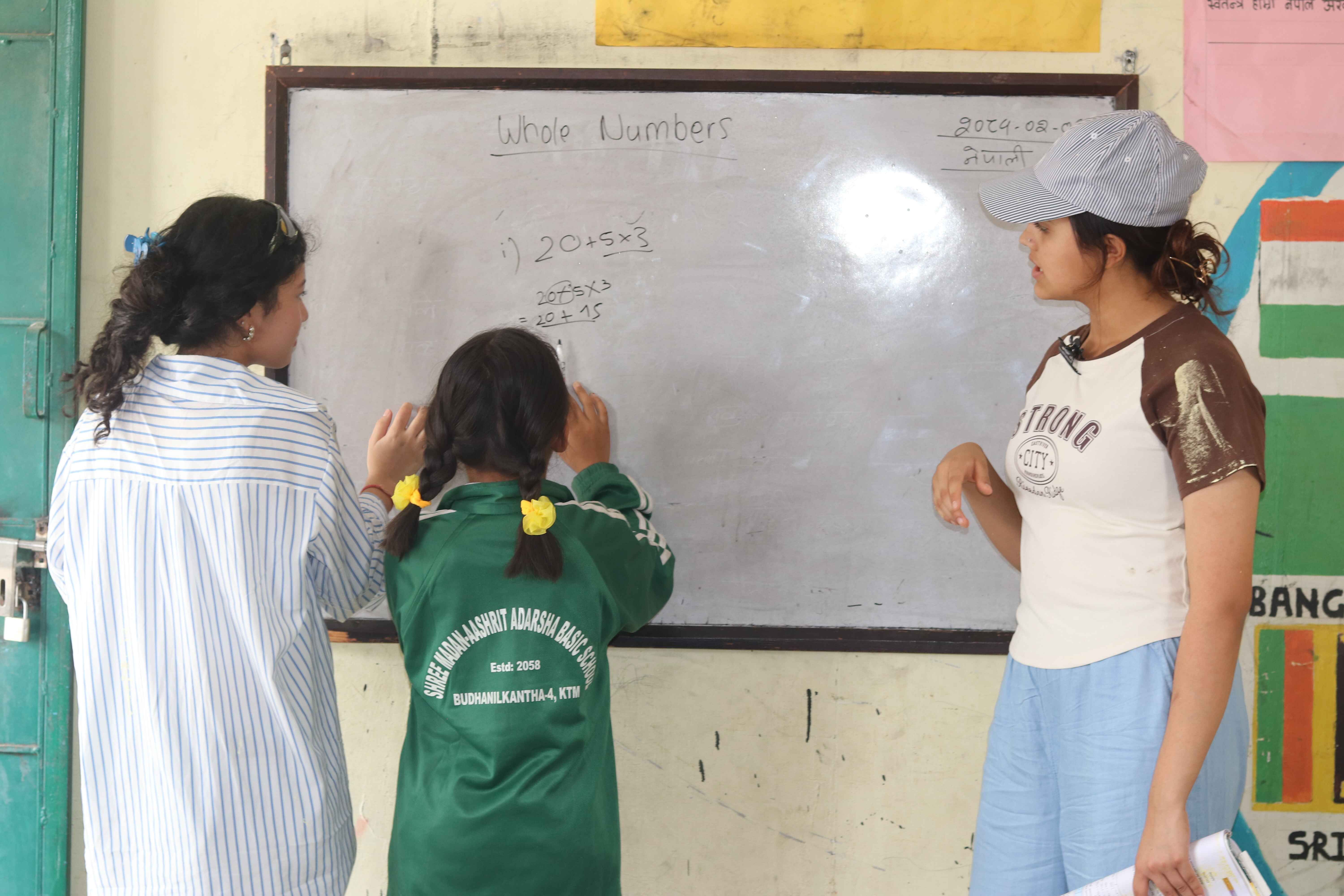 IWS students engage in community service at Madan Ashrit Adarsha Basic School, May 19, 2024, fostering compassion.