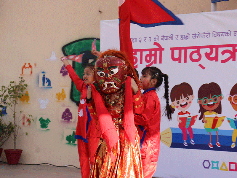 Imperial World School students perform at a 2024 cultural event in Kathmandu, showcasing Nepali curriculum through dance and music.