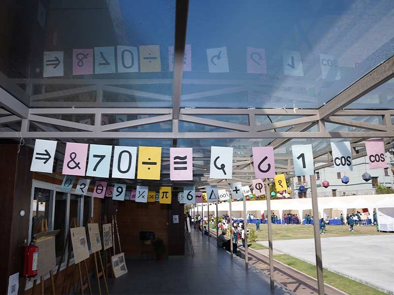 Imperial World School students explore math at the 2025 Pi Day event in Kathmandu, engaging in interactive geometry and puzzle activities.