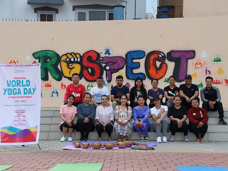 Parents and staff at Imperial World School, Kathmandu, practice yoga with Ms. Sashi Gautam on World Yoga Day, 21 June 2024, in a rejuvenating session.
