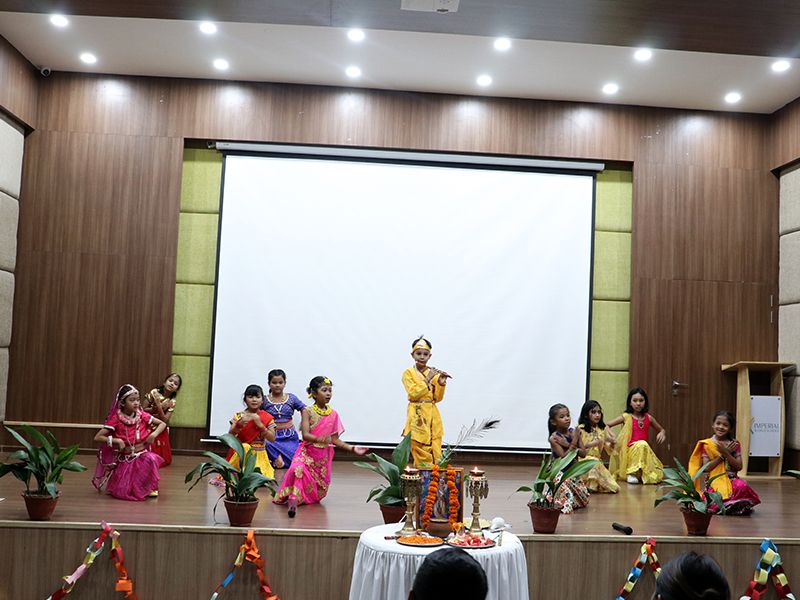 Krishna Janmashtami by Grades 1-3 at IWS, Kathmandu, 26 Aug 2024, with dances, bhajans, and quizzes.