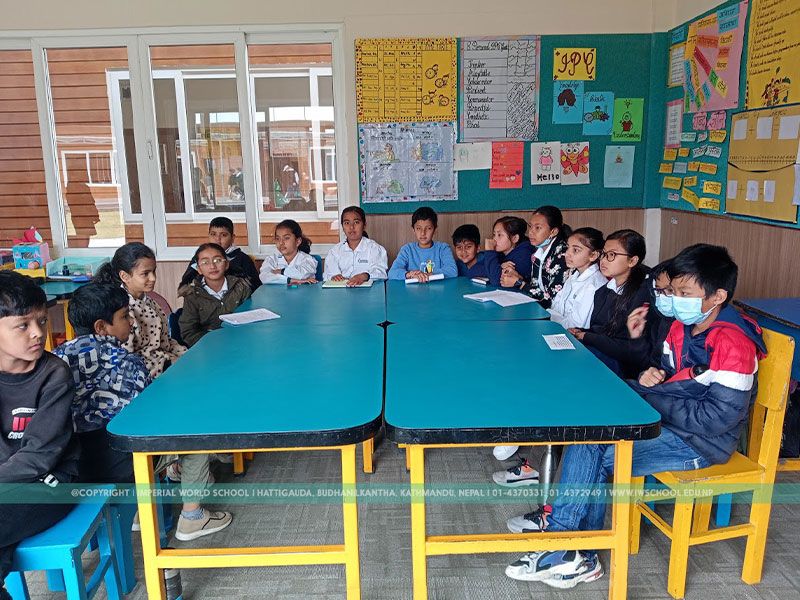 Students at Imperial World School learning in a classroom, seated at desks.