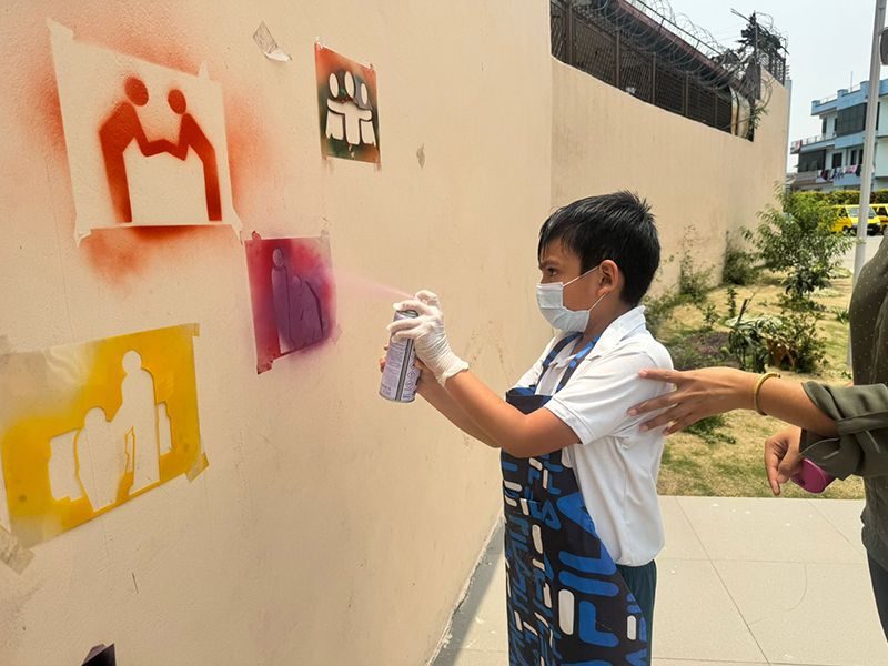 Grade 3 students at Imperial World School explore graffiti art, June 18, 2024, creating vibrant urban murals.